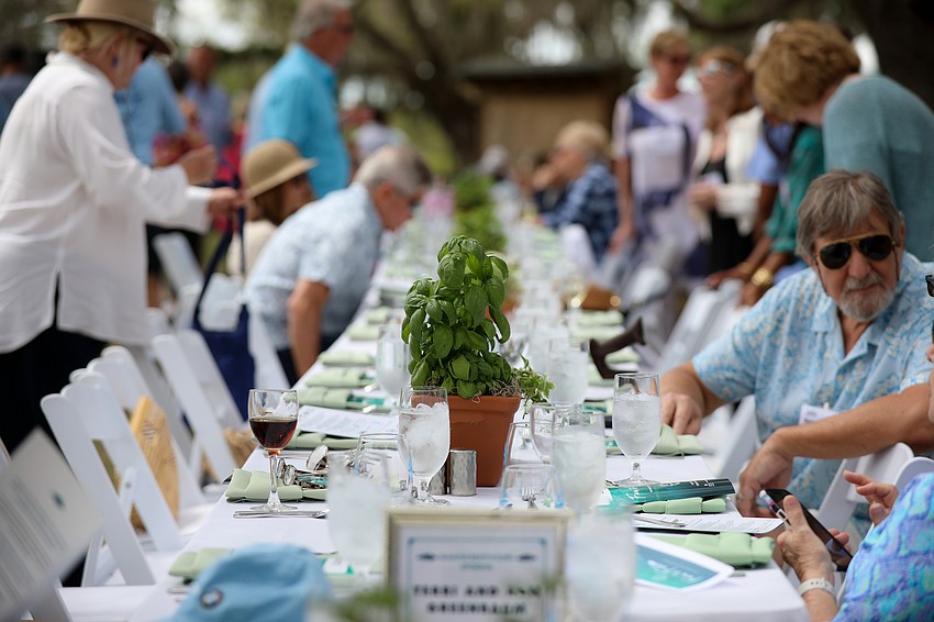 Basil plants served as centerpieces at Mote's Farm to Fillet event held on March 23.