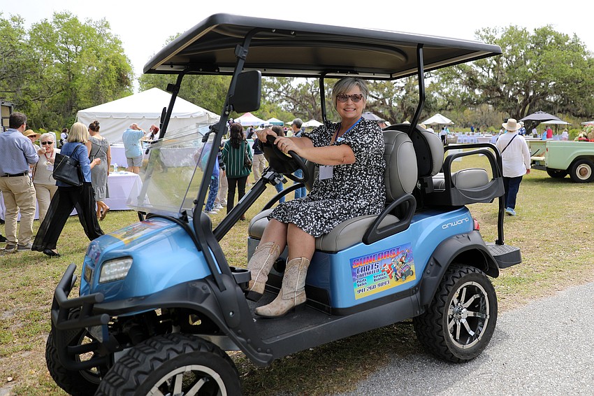 Annette Preston is a Mote Marine philanthropy officer pulling double duty as she moves guests between the parking area and the Farm to Fillet luncheon.