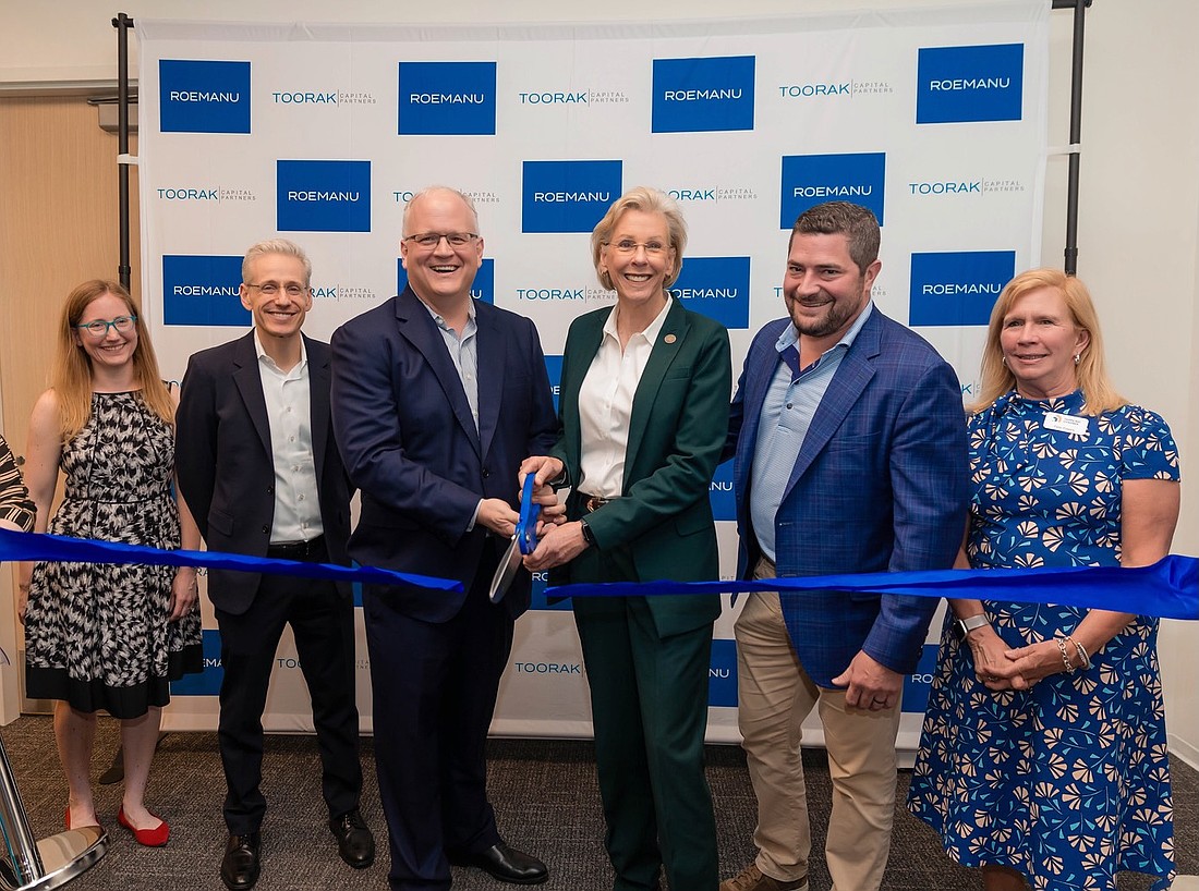 Toorak Capital Partners and its parent company Roemanu celebrate the opening of their joint headquarters in Tampa. Kristy Gilbert, Avi Korn, John Beacham, Tampa Mayor Jane Castor, Josh Taube and Patie Powers