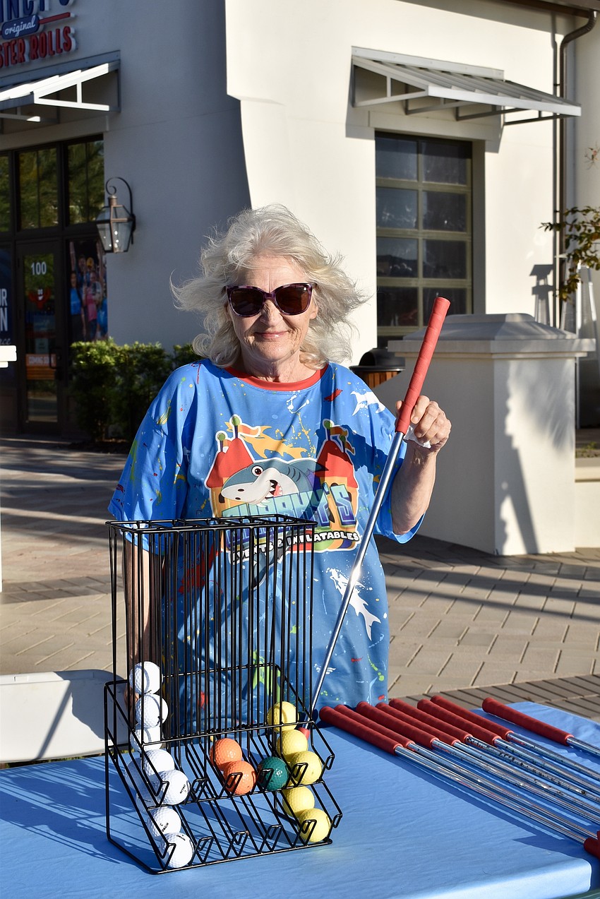 Brenda Kenyon is working for her son Justin Kenyon, owner of Sharky's Events & Inflatables, which sets up a 9-hole miniature golf course at Gateway Park once a month during Ranch Nite Wednesdays.