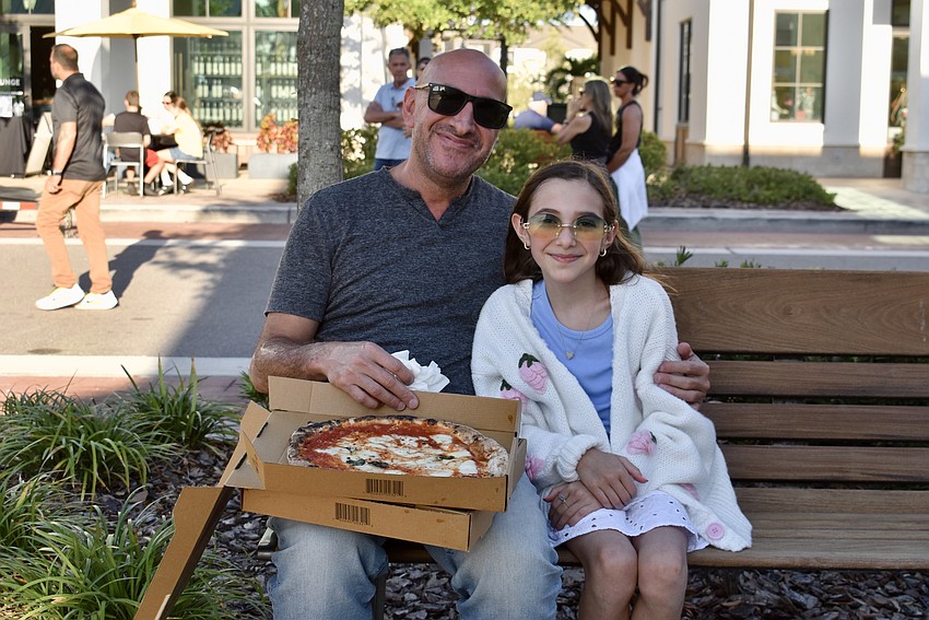 Sarasota's Eyal and Lacey Ohana are ready to dig into some wood-fired pizza.