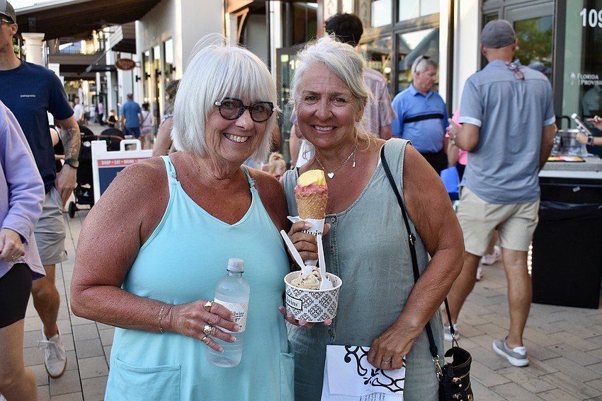 Wisconsin snowbirds Connie Wiersma and Sue Kennedy Kallio indulge in some ice cream from Kilwins.