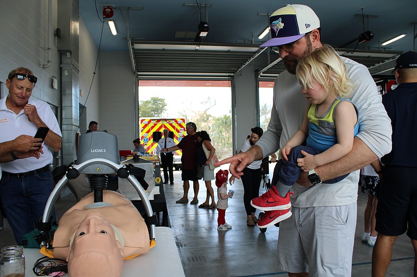 Apollo and Simon Plashkes see a demonstration on the latest in resuscitative technology.
