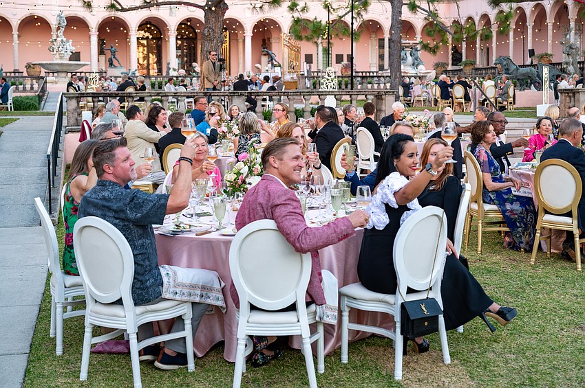 Guests have a Champagne toast.