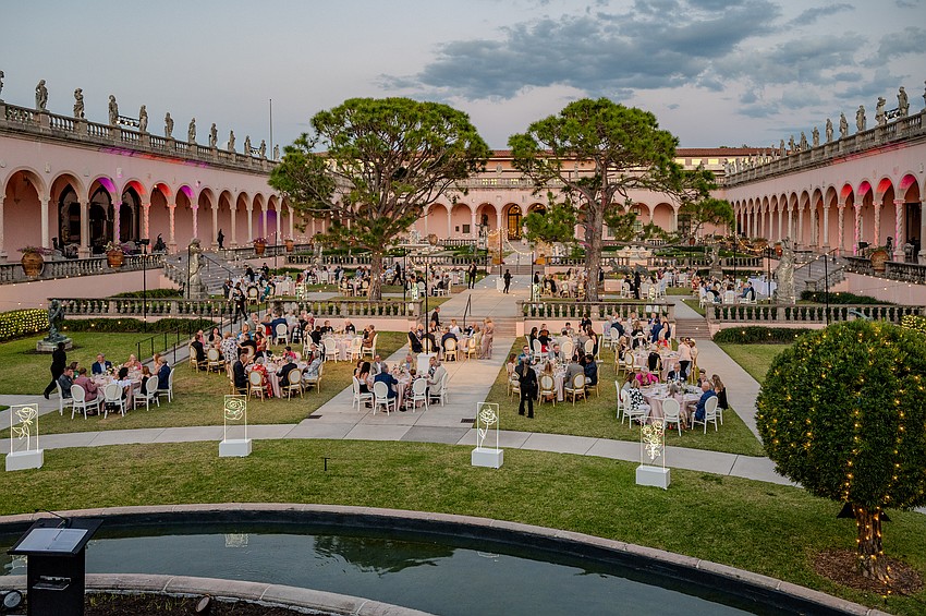 Guests sit down for dinner in the Ringling Courtyard.