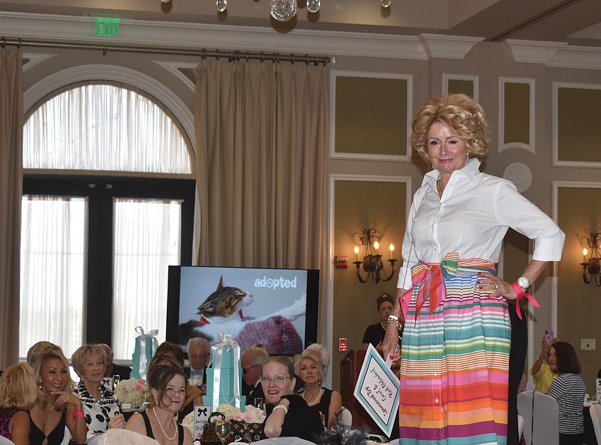 Susan Jenkins makes a bright statement during the Divas and Dogs fashion show.