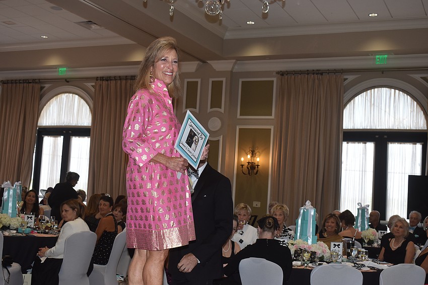 Model Jill Wellinger enjoys her walk during the Divas and Dogs fashion show.