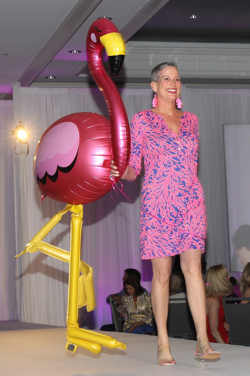 Model Wendy Rossiter and her blowup flamingo rock the SPARCC runway event.
