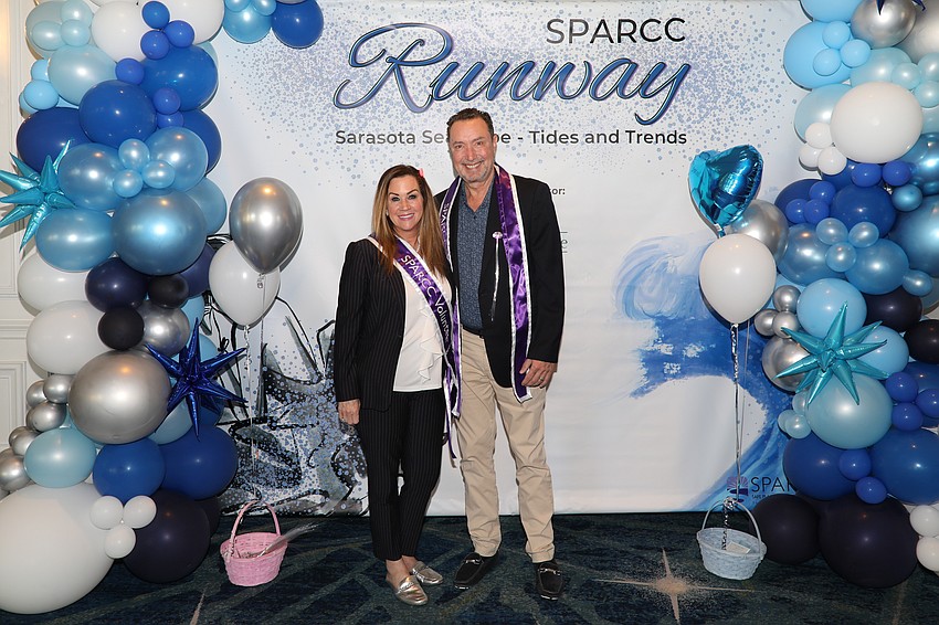 Team Michelle Brault-Clarke and Joe Clarke are volunteer raffle ticket sellers at the SPARCC luncheon.