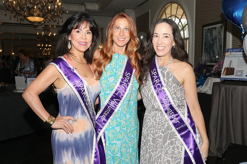 Cici Couchot, Emily Meinke and Kris Ravenscroft volunteer at the annual fashion show held at the Ritz-Carlton on March 28.