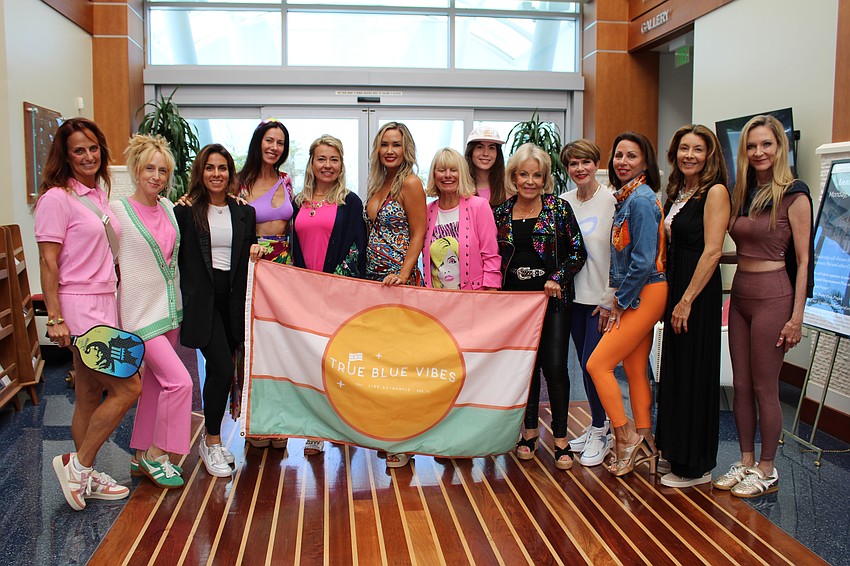 Models prepare to walk to runway at Sarasota Yacht Club's 2025 fashion show.