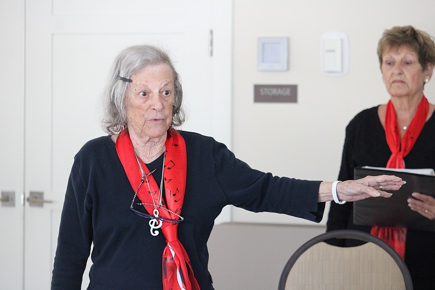 Judie Lutsky, one of the founding members of the Key of Sea choir, joins in the Player's Club performance.