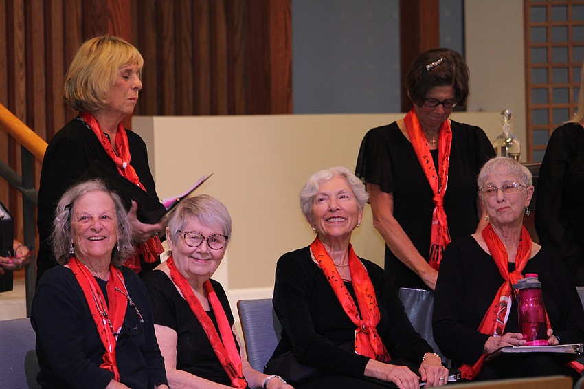 Surrounded by fellow choir members, Marilyn Bobrin smiles at the end of the St. Armands Key Lutheran Church performance.