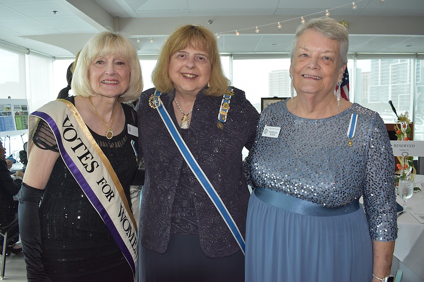 Chaplain Diane Kingery Gentsch, Florida State Regent Cindy Addison and chapter Regent Patricia Rook gather together.