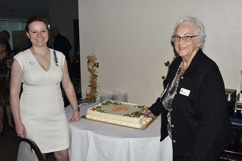 The cake was cut by the youngest member, Liberty Paige, 22, and the oldest member, Mary Lou Barnett Klemm, 91.