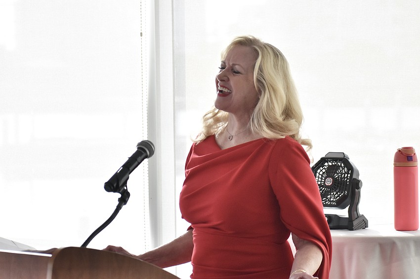 Club member and Sarasota County judge Maryann Olson Uzabel sings 