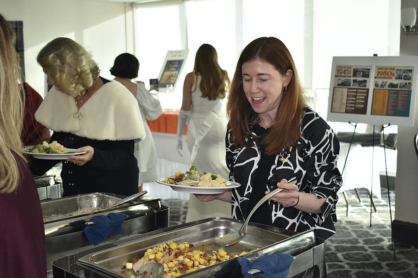 Nan Morgan chats while gathering dinner.