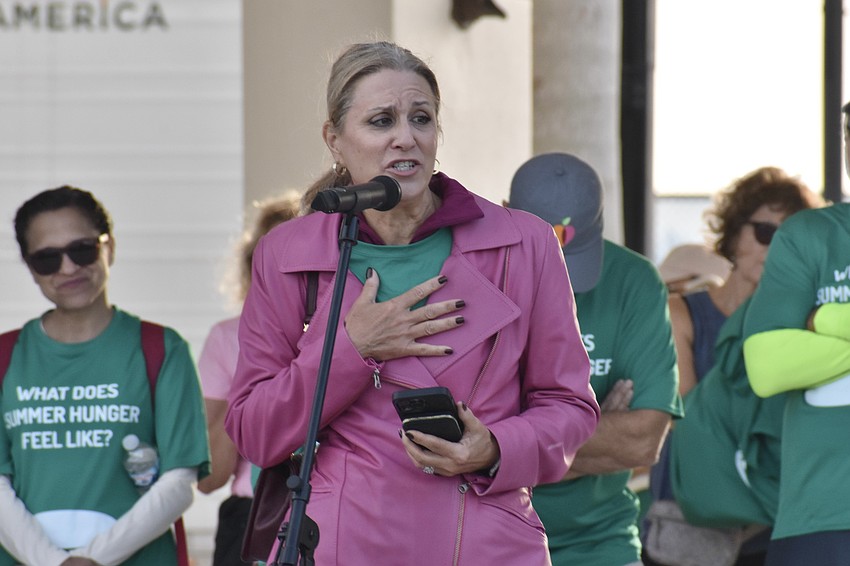 Campaign Against Summer Hunger Chair Lisa Krouse speaks before the walk.