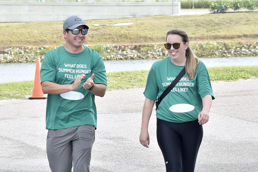 Ruben Campusano and Nicole Mobley complete the walk.