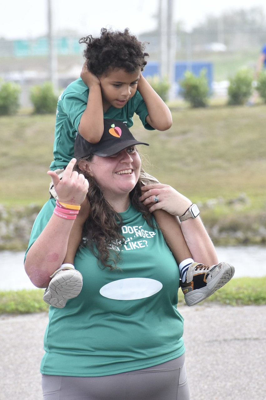 Gabriela Gorka arrives back at the park's Finish Tower with her son Isaac Freeman, 4