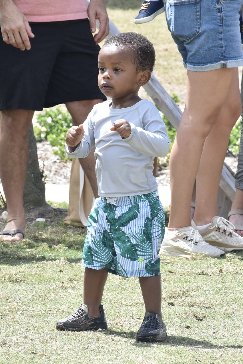 JC Cash, 2, dances to the music.