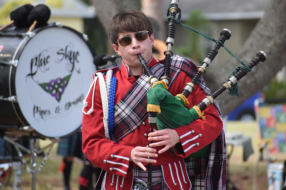 12th grader Gregory Pech, of the Riverview High School Kiltie Band, plays the bagpipes.