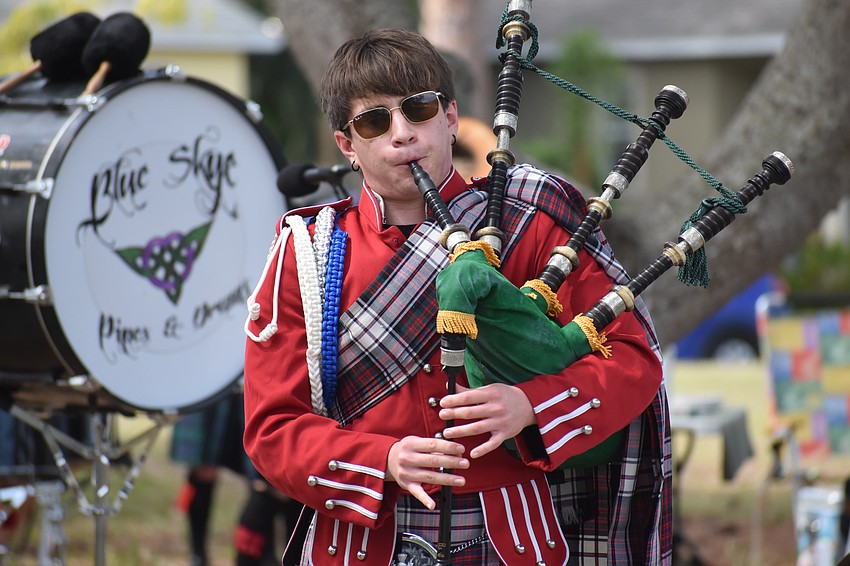 12th grader Gregory Pech, of the Riverview High School Kiltie Band, plays the bagpipes.