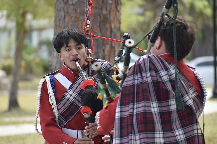 12th graders Danny Alendar and Gregory Pech, of the Riverview High School Kiltie Band, plays the bagpipes.