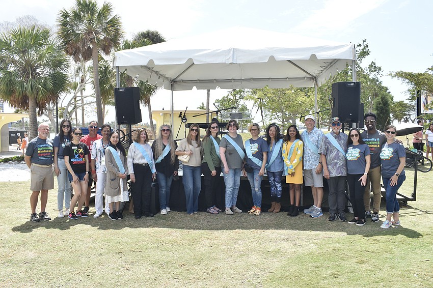 Embracing Our Differences artists and staff gather together.