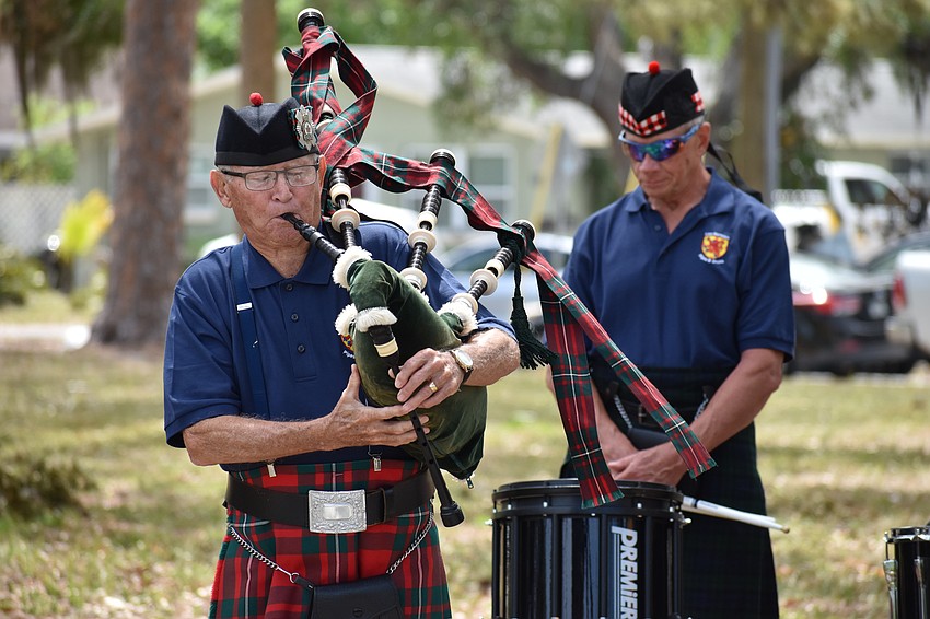 Walter Meixner and Tim Schaver of Lion Rampant Pipe and Drum perform for attendees.