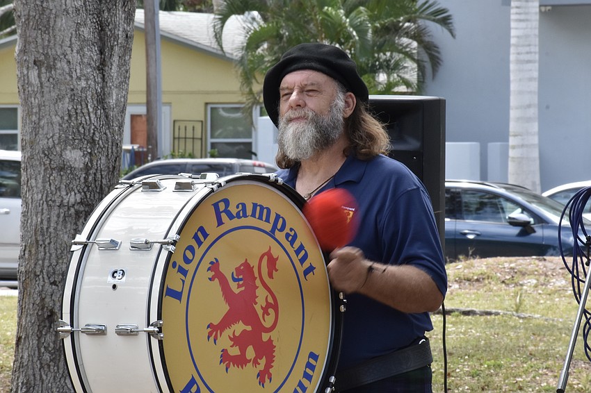 Scott Richards, of Lion Rampant Pipe and Drum, beats his bass drum.