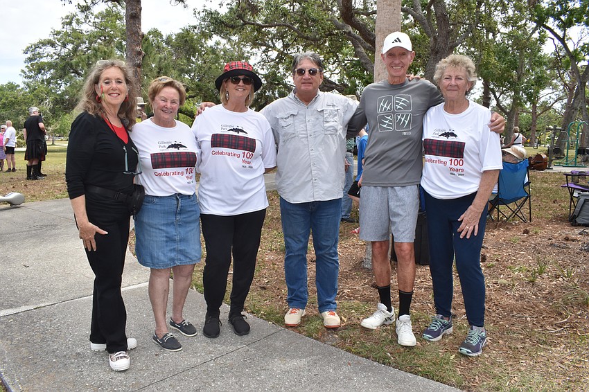 Lynn Elkes, the event chair; Linda Holland, vice president of the Gillespie Park Neighborhood Association, Kelly Brown, president of the neighborhood association; residents Steve Suau and Paul O'Connell and Holland's sister Trish Schunney, gather together.