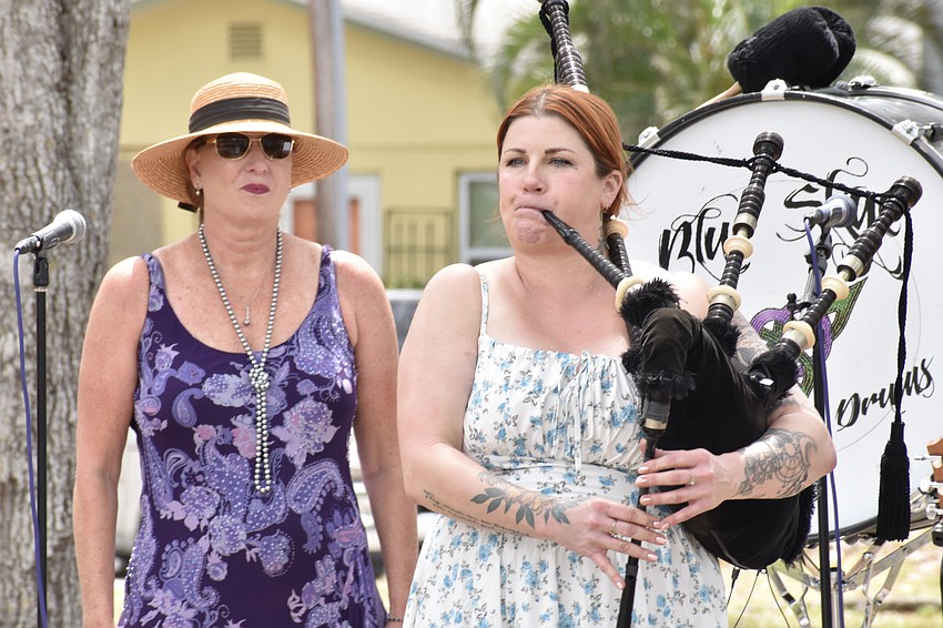 Deborah Dennis and Cassandra Calo of Blue Skye Pipe and Drums help celebrate the occasion.