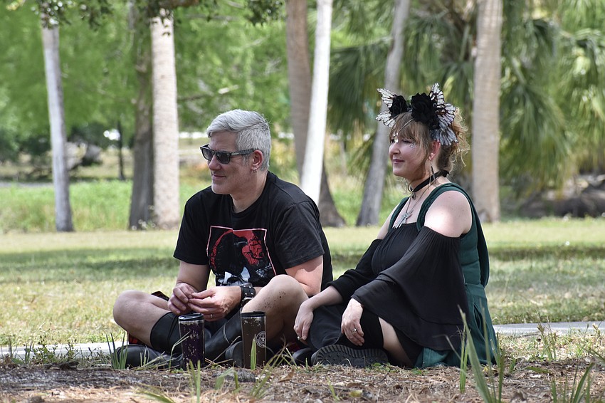 Marty Gworek and his wife Amanda Gworek watch a performance.