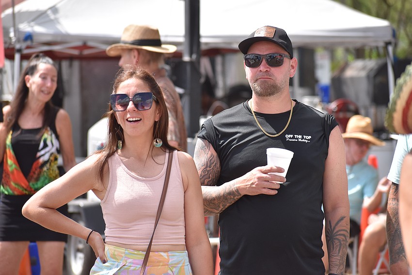 Karen Ferguson and her husband Corey Ferguson watch King Tappa perform.