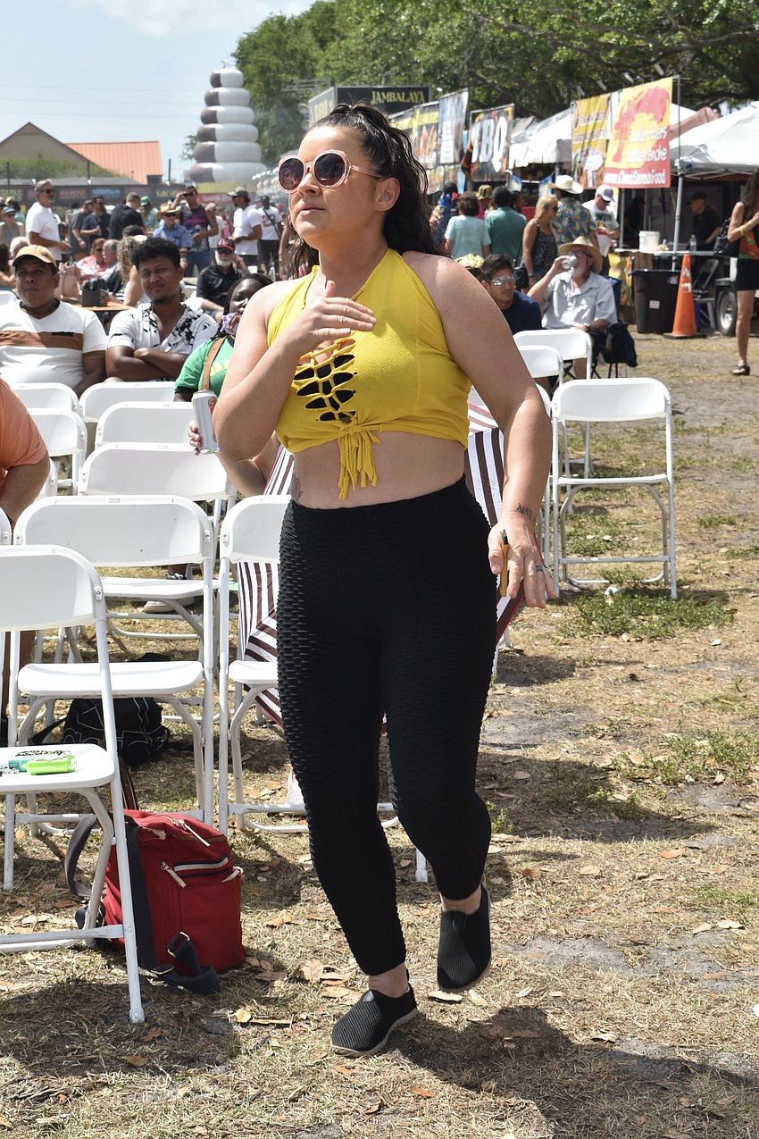 Alisha Holland dances to the music.