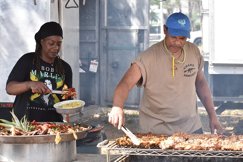 Shevetta McMillaa and Bosworth Hill prepare some Caribbean food.