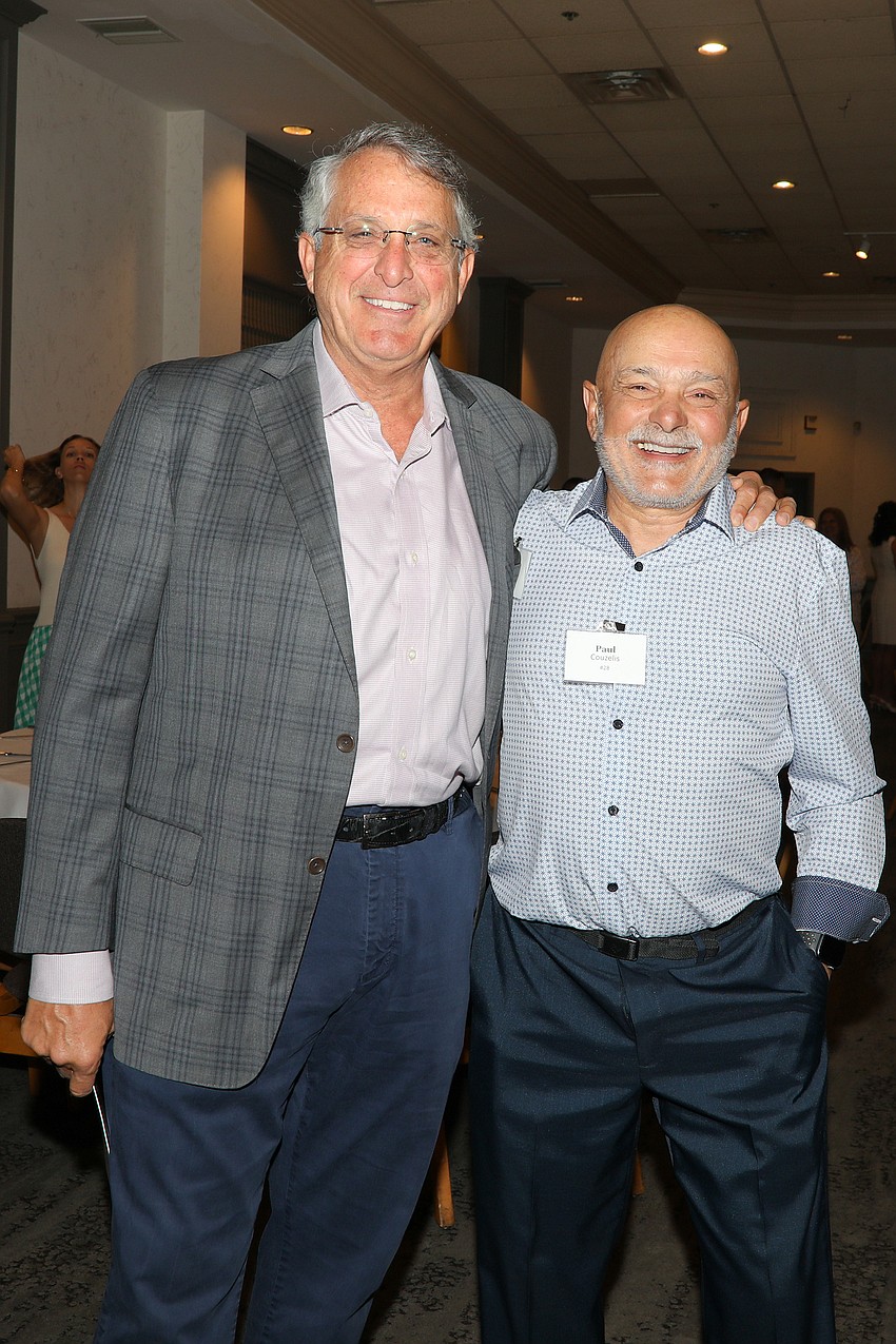 Matthew Straeb and Paul Couzelis and their smiles in support of Safe Children's Coalition.