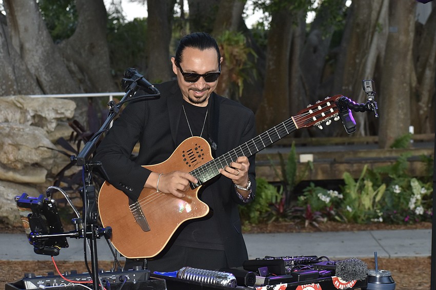 Andres Colin plays the guitar.