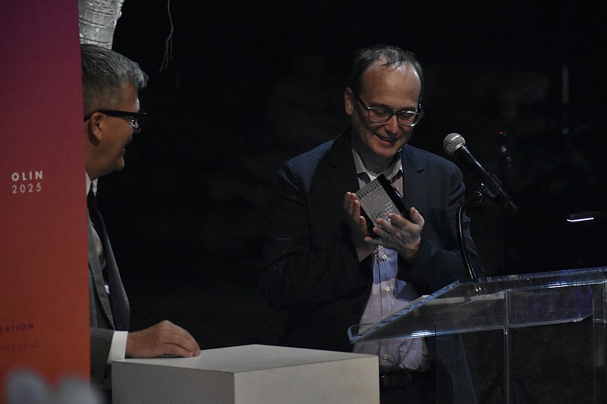 Marty Hylton of Architecture Sarasota presents the award to Richard Roark of OLIN.