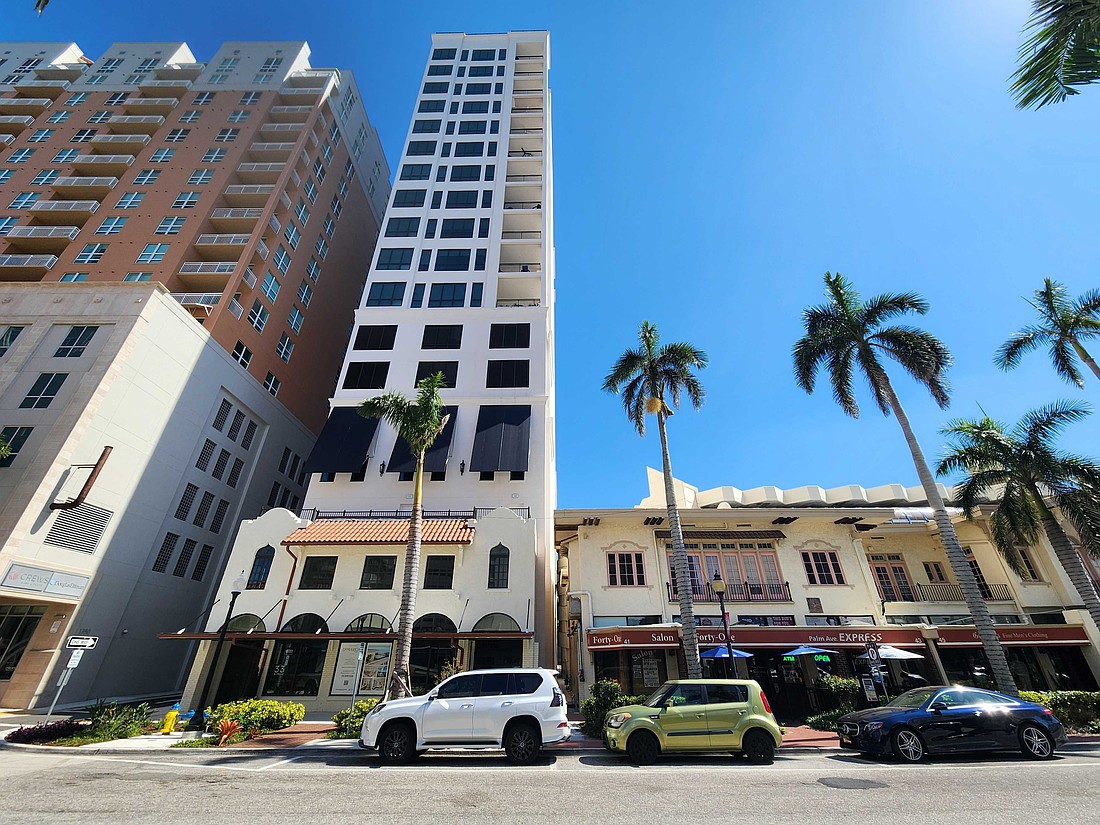 A contrast in scale with the new Demarcay 18-story condo tower only a few feet away from the Mira Mar Building.