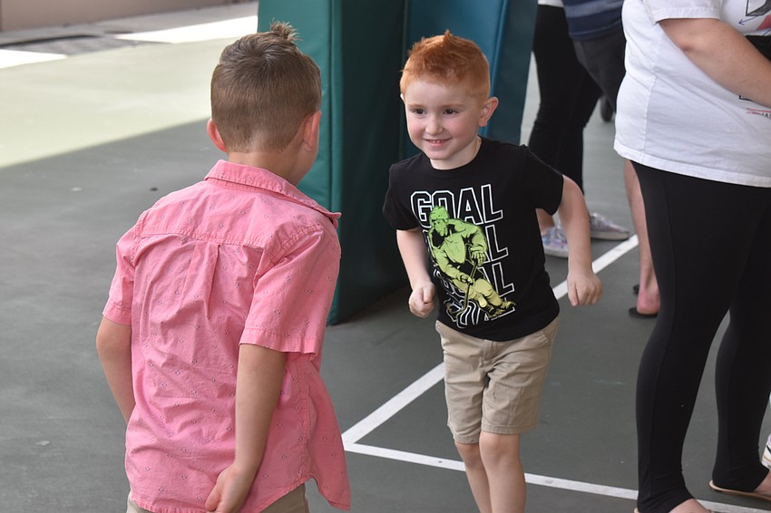 Pre-K students Sawyer Beasley and Bronxton Budd enjoy some fun time before the musical performances.
