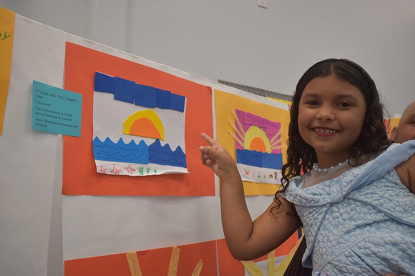 Second grader Alessia Acosta is proud of her artwork.