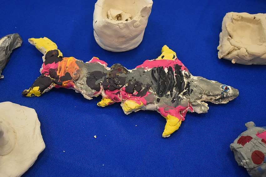 The fourth grade students made sharks out of clay.