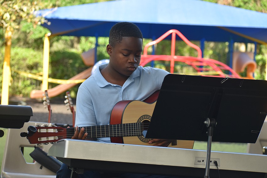 DJ Jean played both guitar and keyboard during his performance.