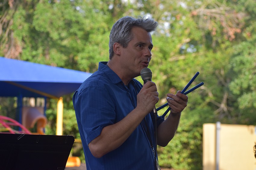 Music teacher Nicholas Haas introduces each song.