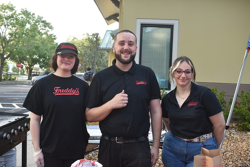 Freddy's workers Hailey Day, Justin Stewart and Delaney Bumbara served burgers and hotdogs.