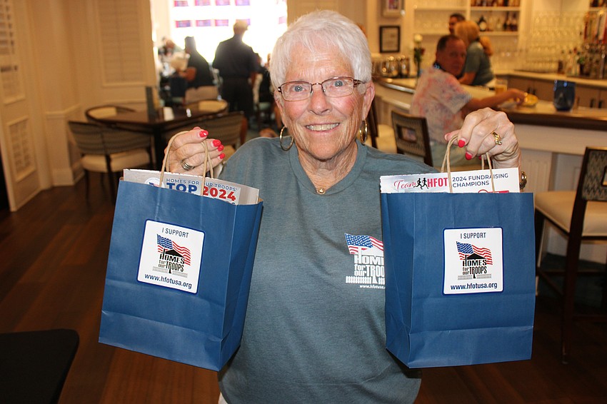 Jackie Demerly, who hands out gifts to the golfers, has been a volunteer at the Rosedale Golf Classic to support Homes for Our Troops for more than 10 years.