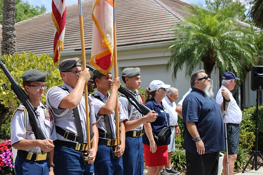 Sarasota Military Academy students Pierce Mihailoff, Aiden O'Kon, Joey Miguel, and Zachary Jewell present the colors with honoree Army Sgt. Aaron Cornelius at the Rosedale Golf Classic April 2.