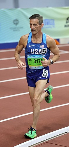 Paul Shuler runs the age 55-59 3,000-meter race in the World Masters Athletics Indoor Championships at the Alachua County Sports & Events Center in Gainesville. Courtesy photo by SaggysPhotos.com